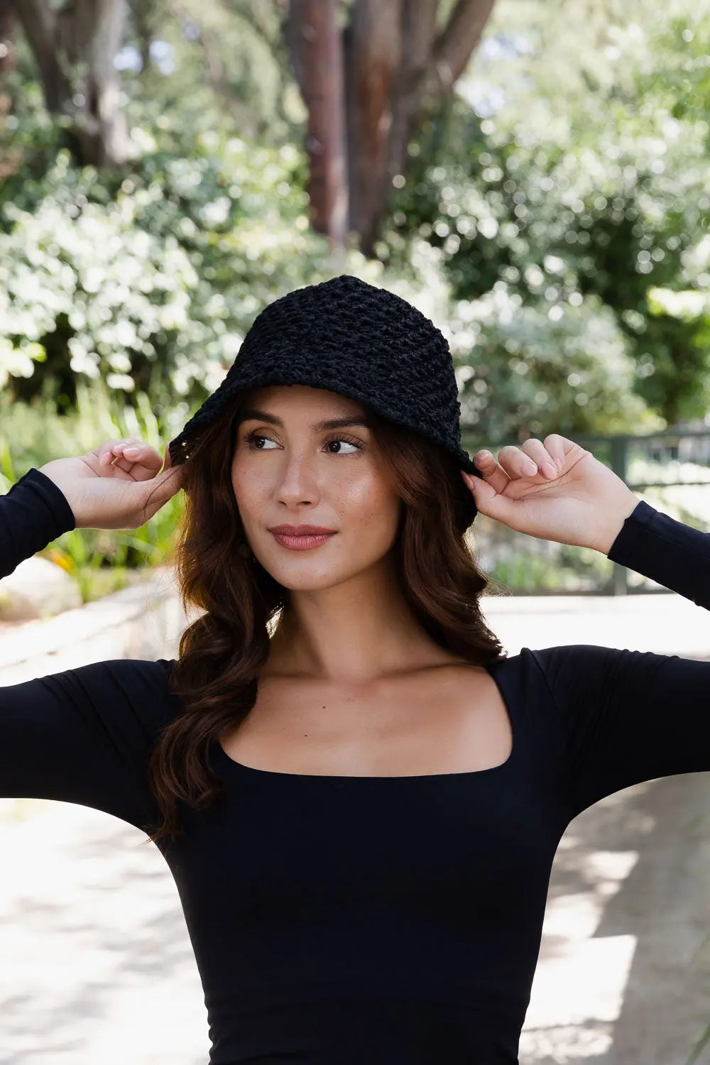 Black handwoven crochet bucket hat with dense textured knit, slouch fit