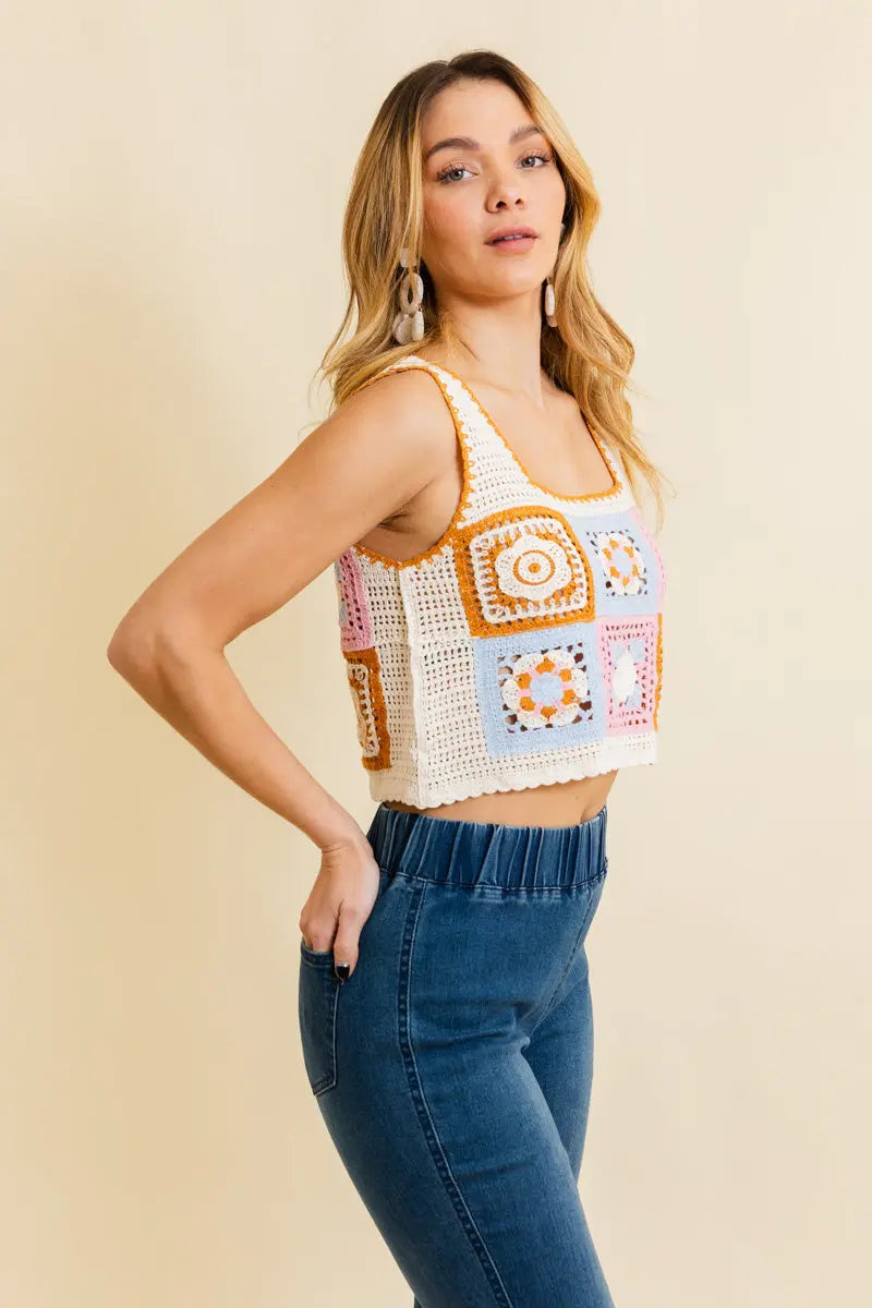 Crochet crop top with patchwork square motifs and scalloped hem, mustard and pink accents