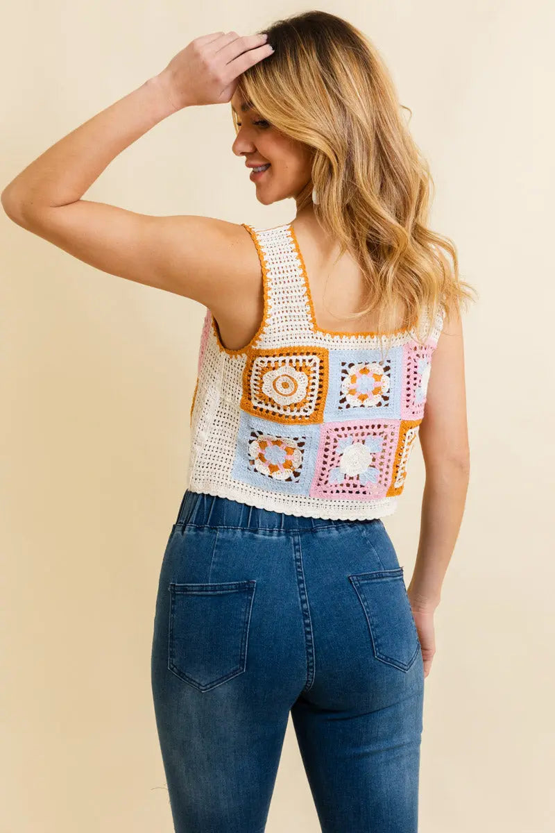 Crochet crop top with square patchwork front, thin straps, mustard and pink floral details