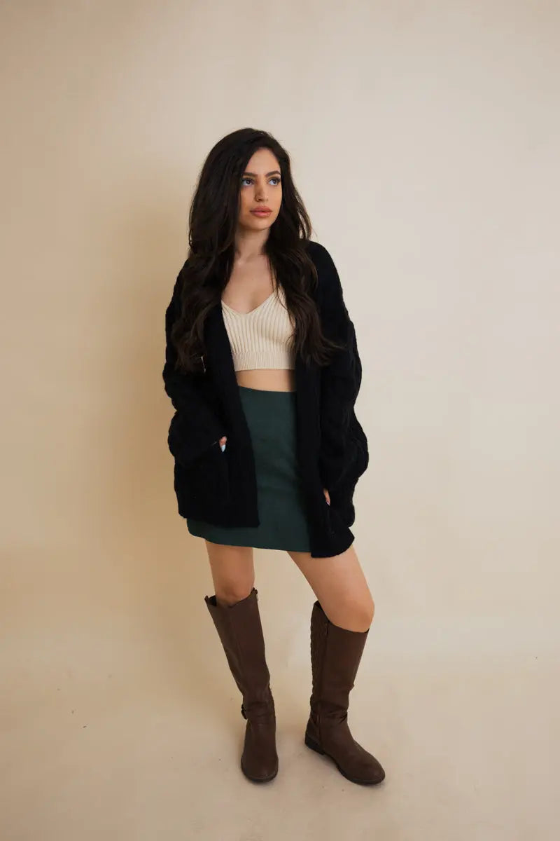 Black cable-knit open cardigan with long sleeves and cable texture, front view