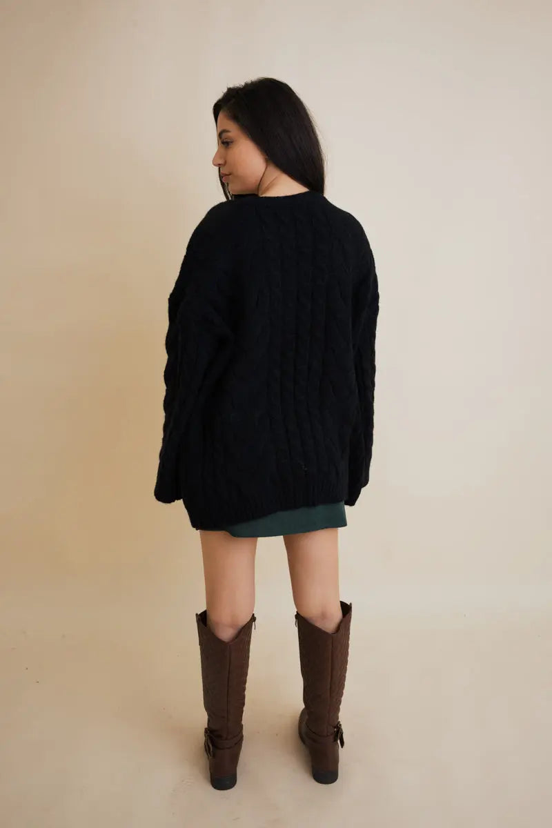 Black cable-knit open cardigan, back view with long sleeves and cable knit pattern