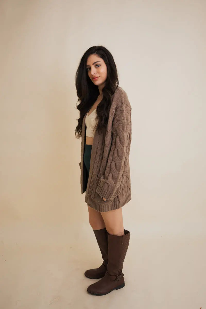 Brown cable knit open cardigan, side view, long sleeves, ribbed hem and cuffs