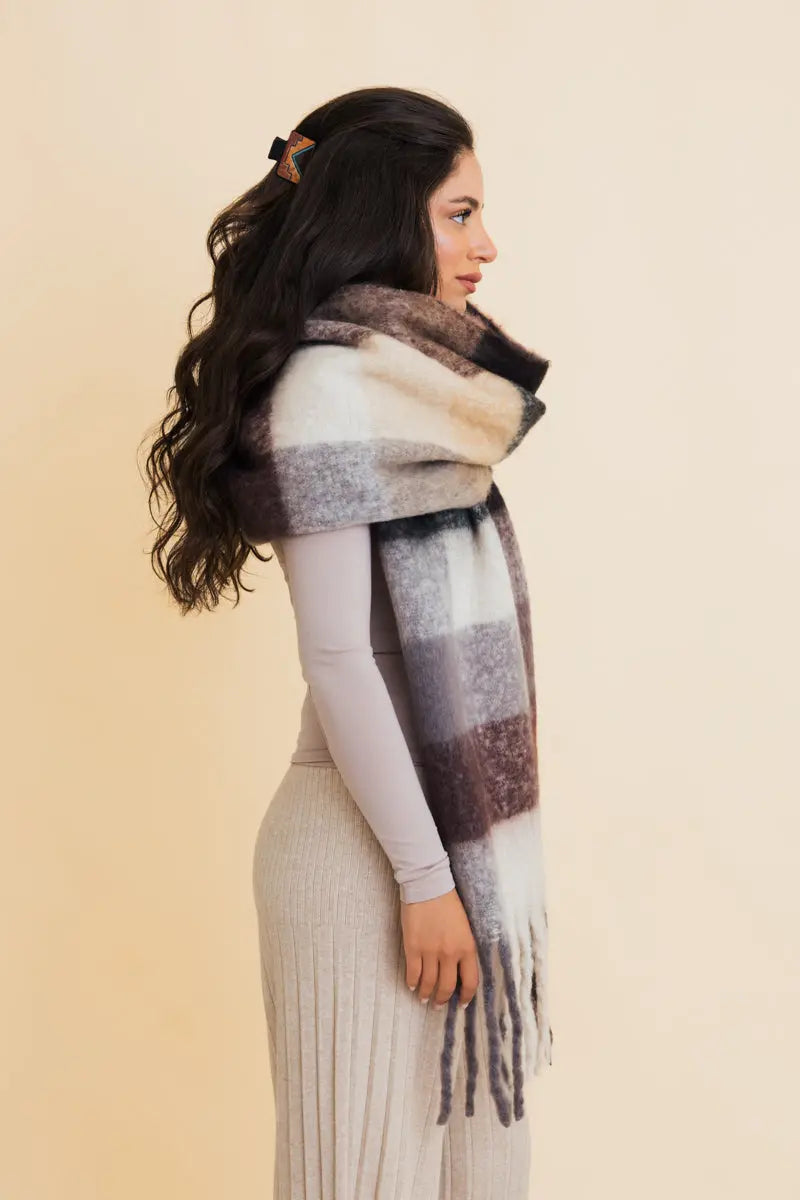 Oversized plaid fringe scarf in charcoal and gray with long tassels on side view