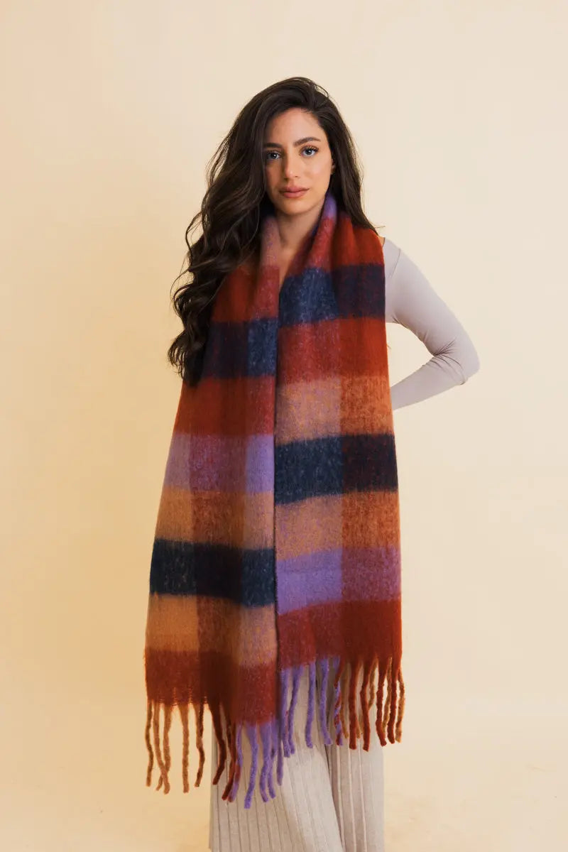 Oversized plaid fringe scarf in rust, blue, and navy blocks