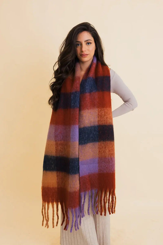 Oversized plaid fringe scarf in rust, blue, and navy blocks