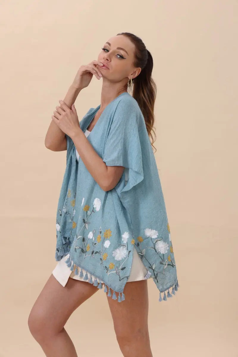 Blue floral embroidered kimono cardigan with tassel hem and draped sleeves