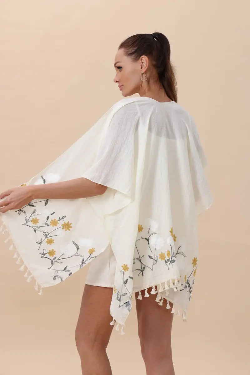 White floral embroidered kimono cardigan back view with tassel trim at hem