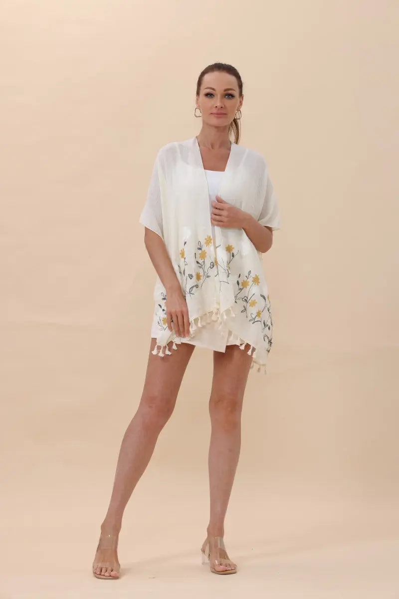 White floral embroidered tassel hem kimono cardigan with open front and fringe trim