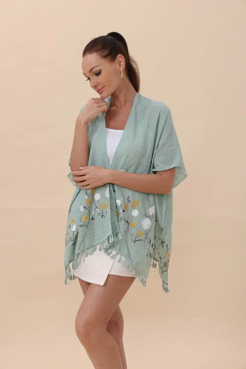 Sage green kimono cardigan with floral embroidery and fringe tassel hem