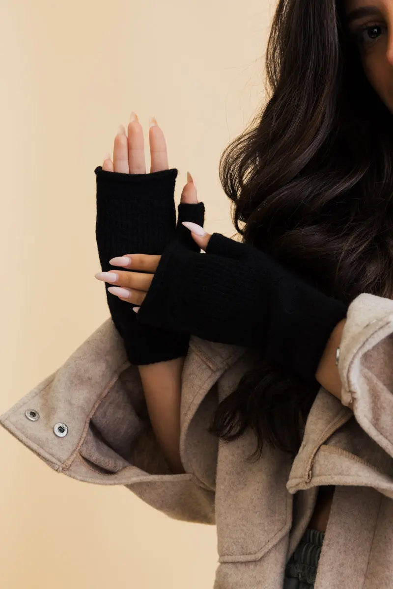 Black knit open-finger mittens for winter hand warming, phone-friendly finger cutouts