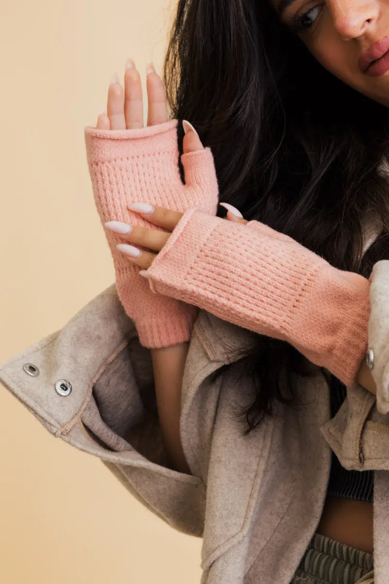 Pink knit open-finger mittens for winter warmth, phone-friendly finger cutouts