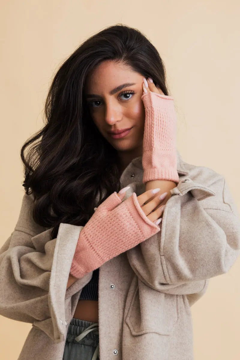 Pink open-finger winter mittens with soft textured knit and exposed fingertips for phones