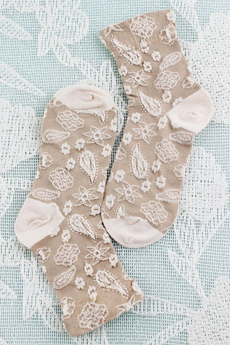 Cream cashew-print crew socks with textured embroidered-style motifs