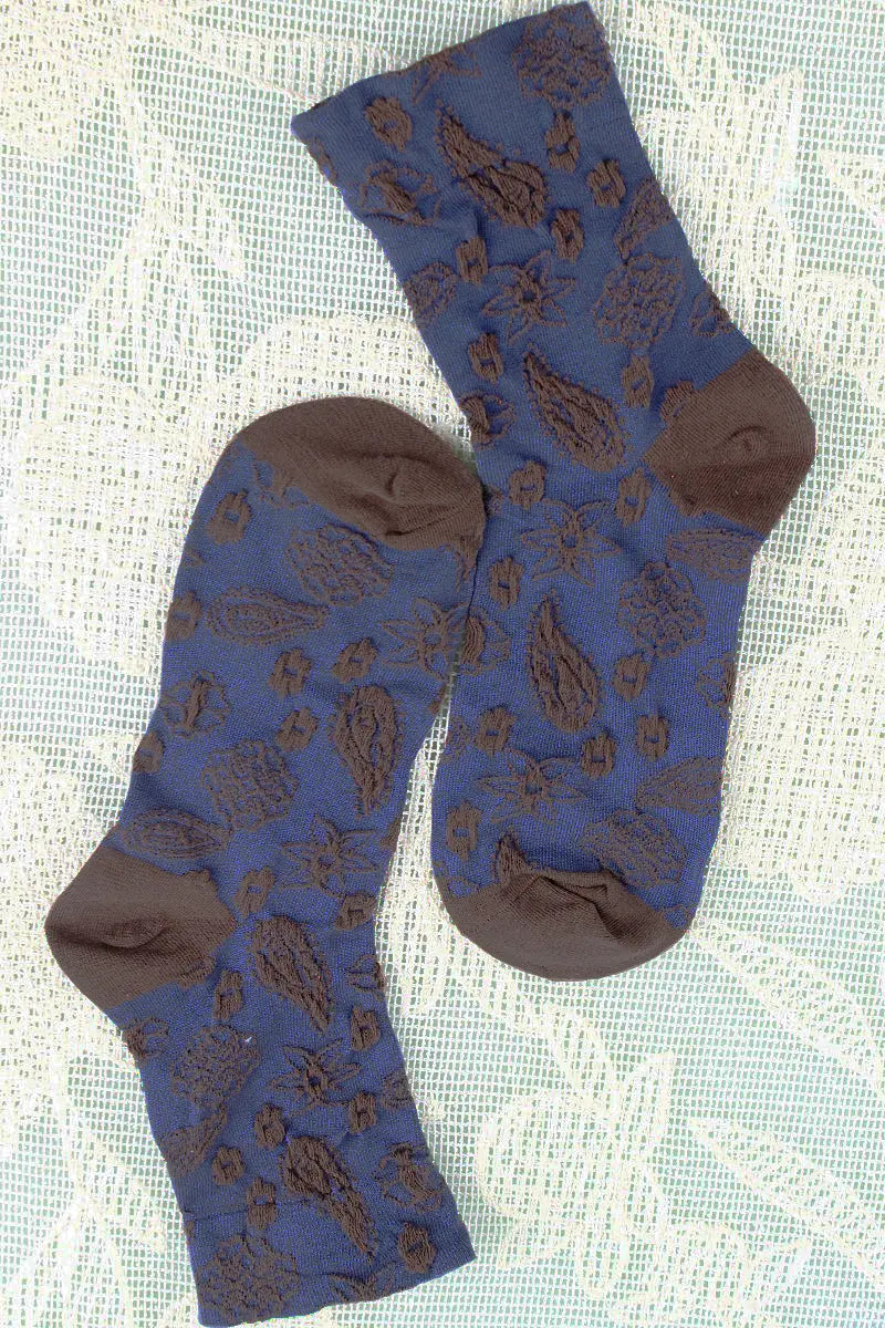 Medium blue cashew-print crew socks with repeating nut-style designs