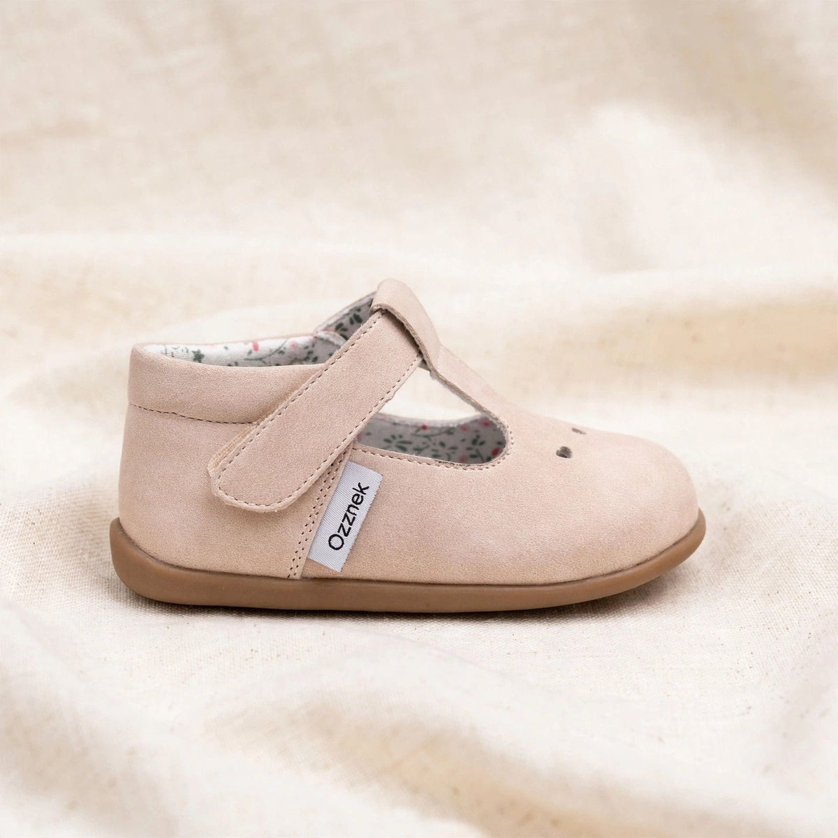 Side view of blush pink kids Mary Jane slip-on shoes with printed inner lining