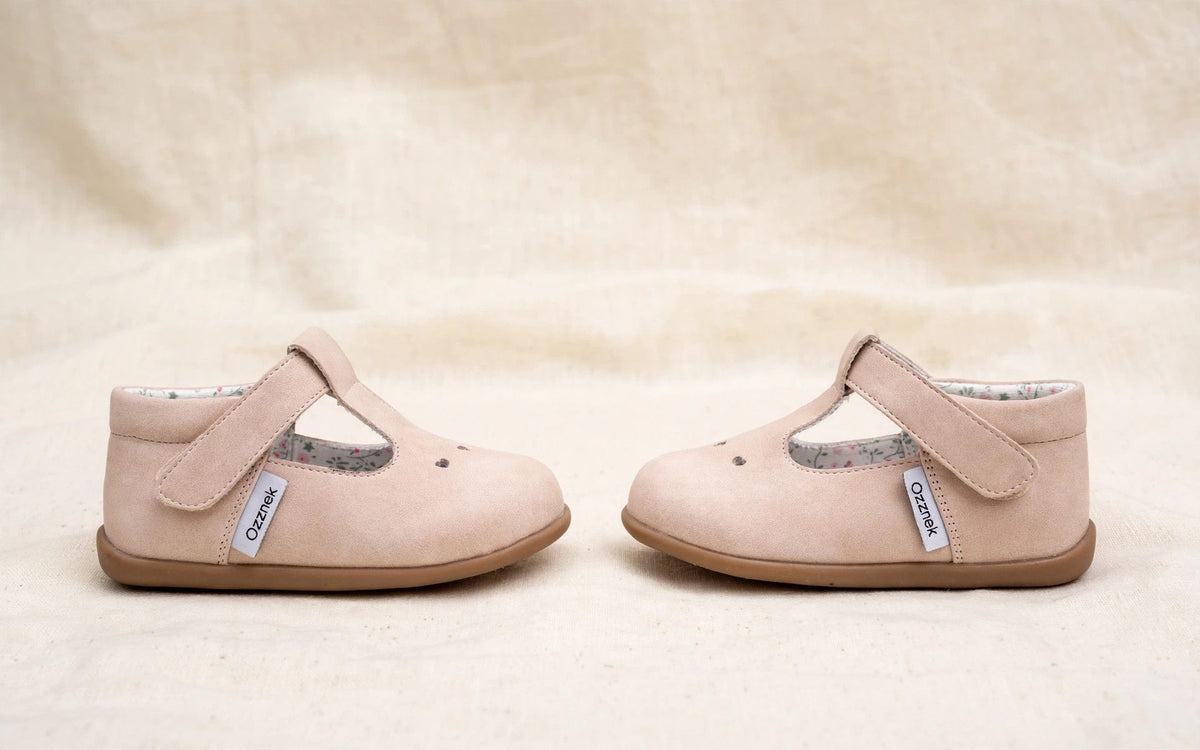 Pair of blush pink kids Mary Jane slip-on shoes, rounded toe and strap