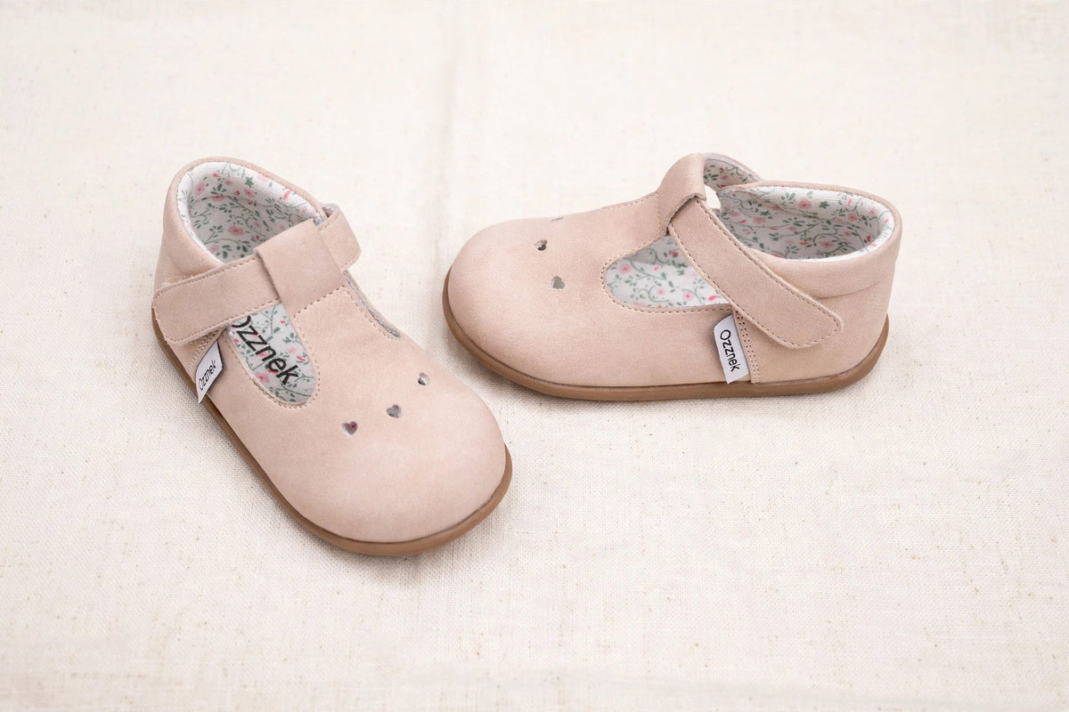Two-tone angle view of blush pink kids Mary Jane slip-on shoes, floral lining