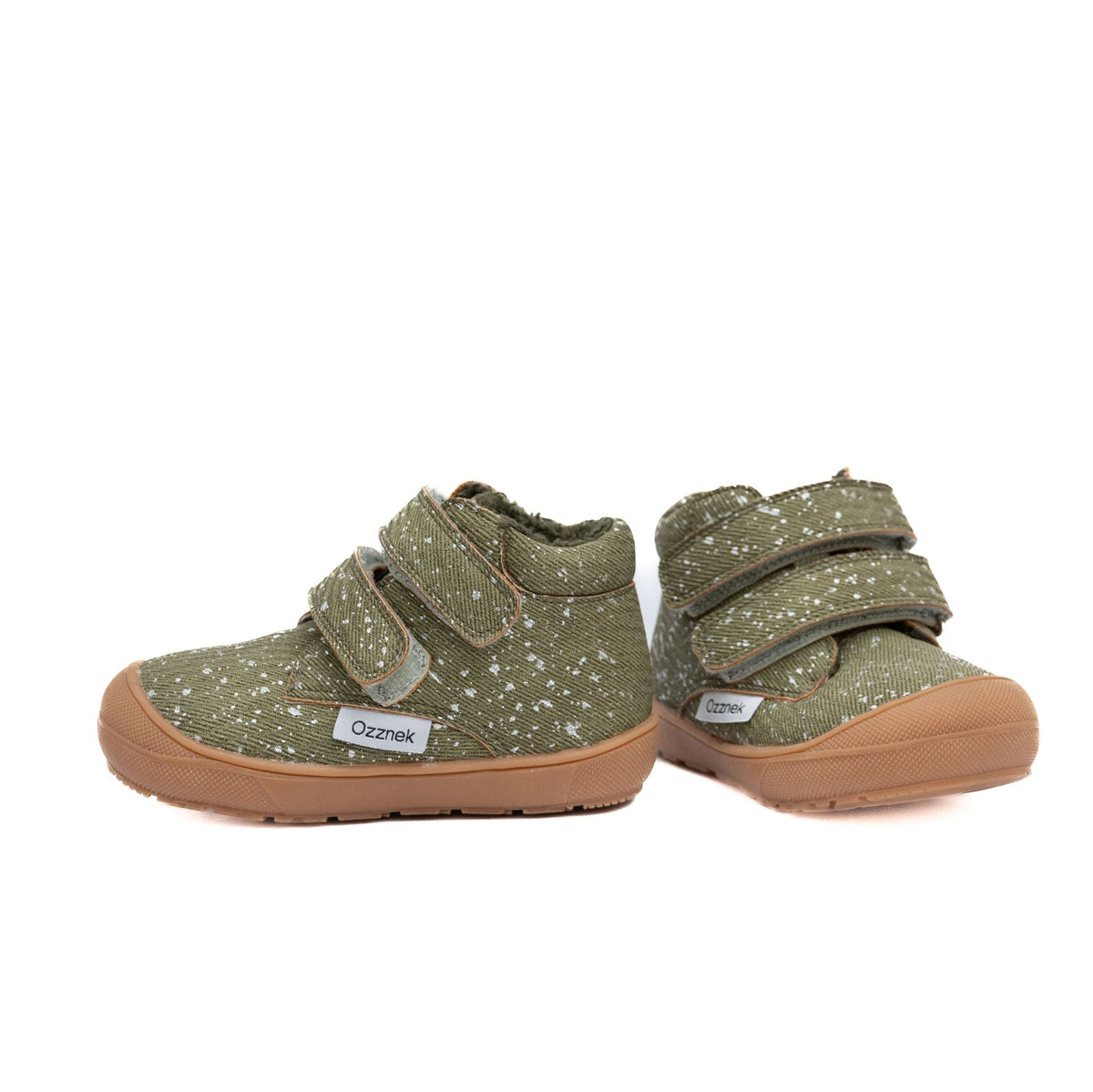 Pair of olive toddler boots with speckled uppers, hook-and-loop straps, tan sole.