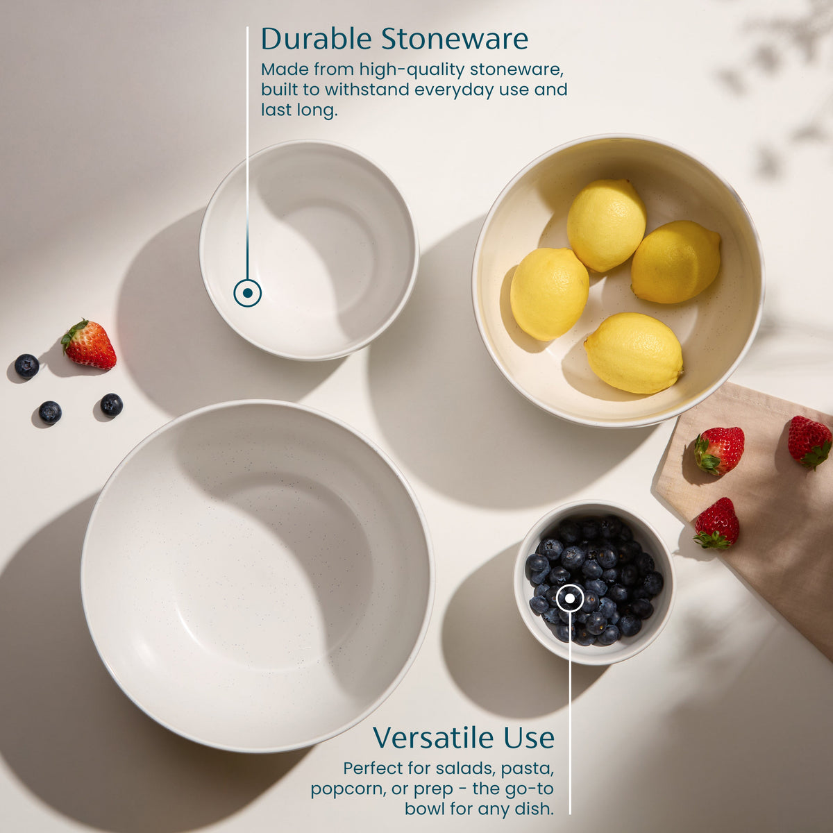 Ceramic nesting bowls set in speckled off-white, multiple bowls with food ingredients