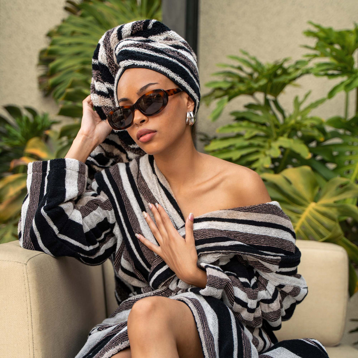 Black-and-white striped hooded bathrobe with tie belt and front pockets