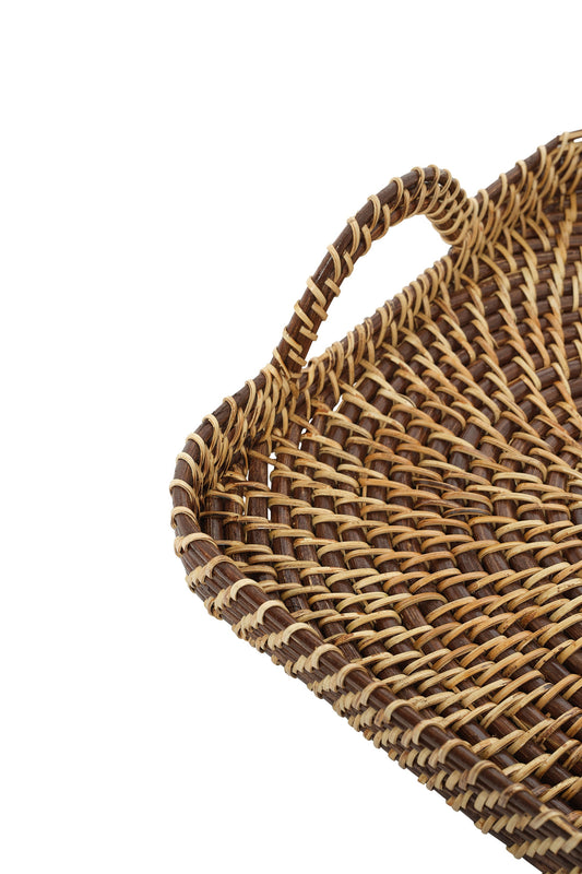 Woven tray corner with raised braid edge and curved carrying handle