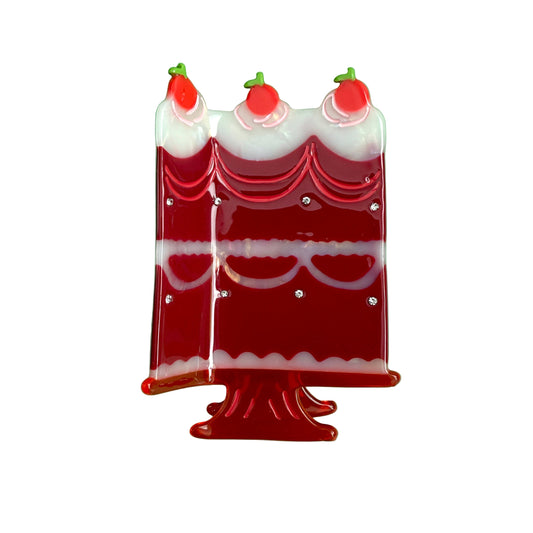 Cake-shaped hair claw with red cherry candle tops and white scalloped layers