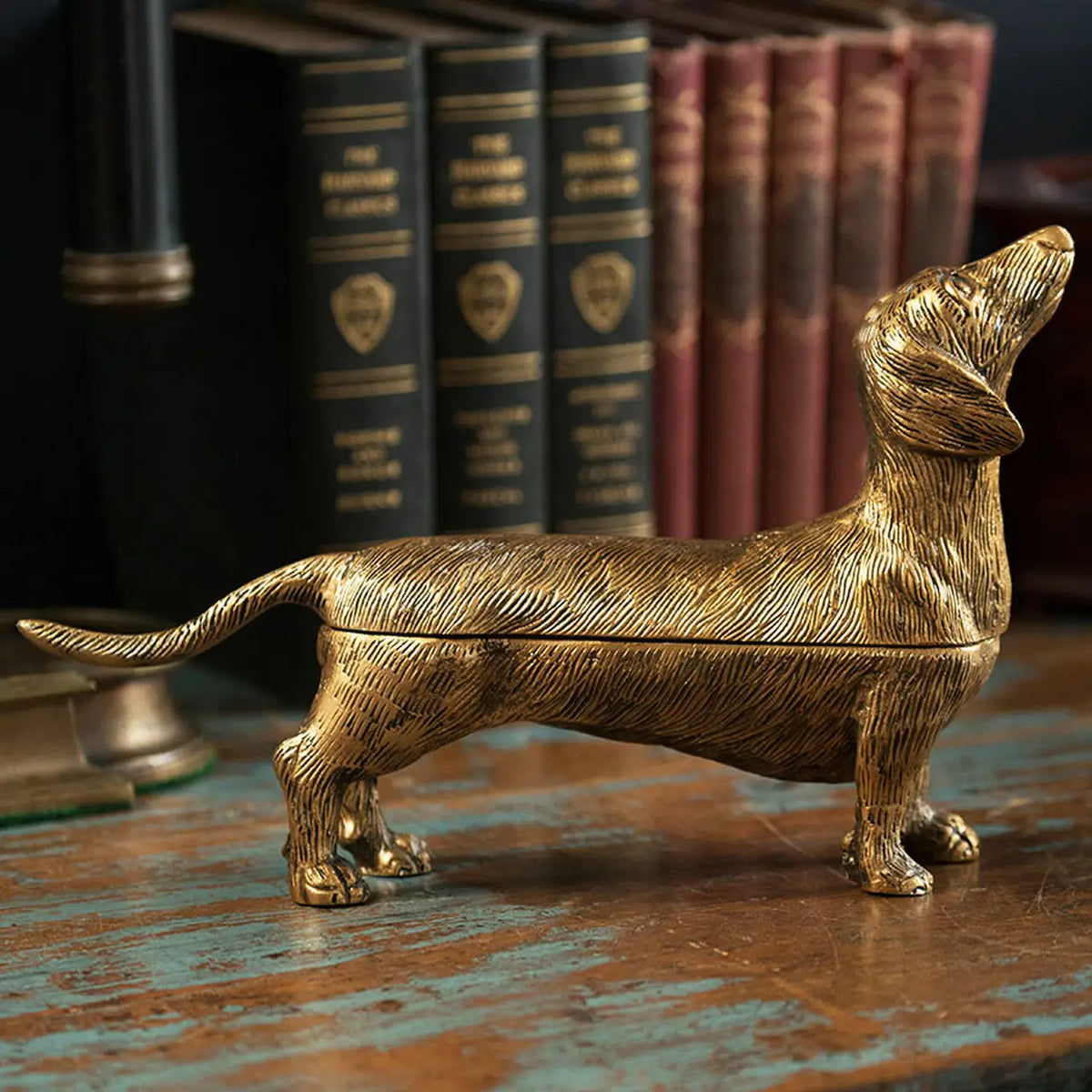 Brass-finish dog-shaped storage box with a lift-off back and detailed fur texture