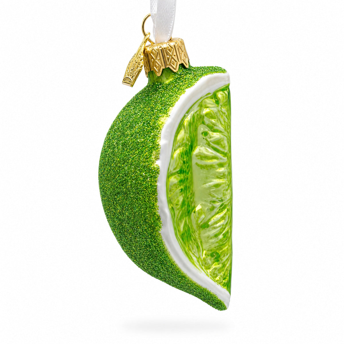 Green lime-slice glass Christmas ornament with glitter finish and gold cap hanger.