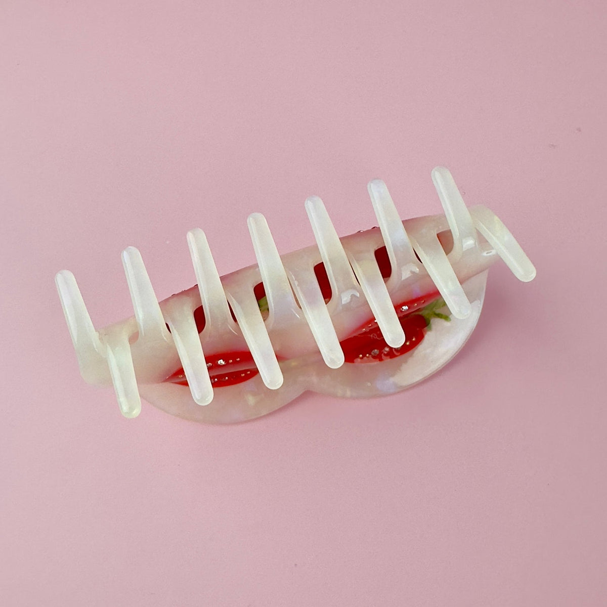 Tomato-themed hair claw clip back view with long white teeth and red tomato accents