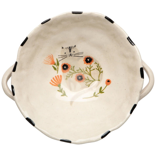 Catbloom footed bowl in cream with cat face, flowers, and black dot accents