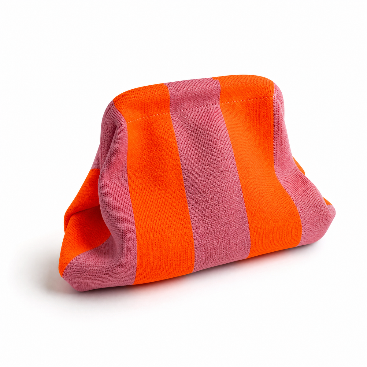Striped orange and pink fabric clutch bag, side view with soft folded shape