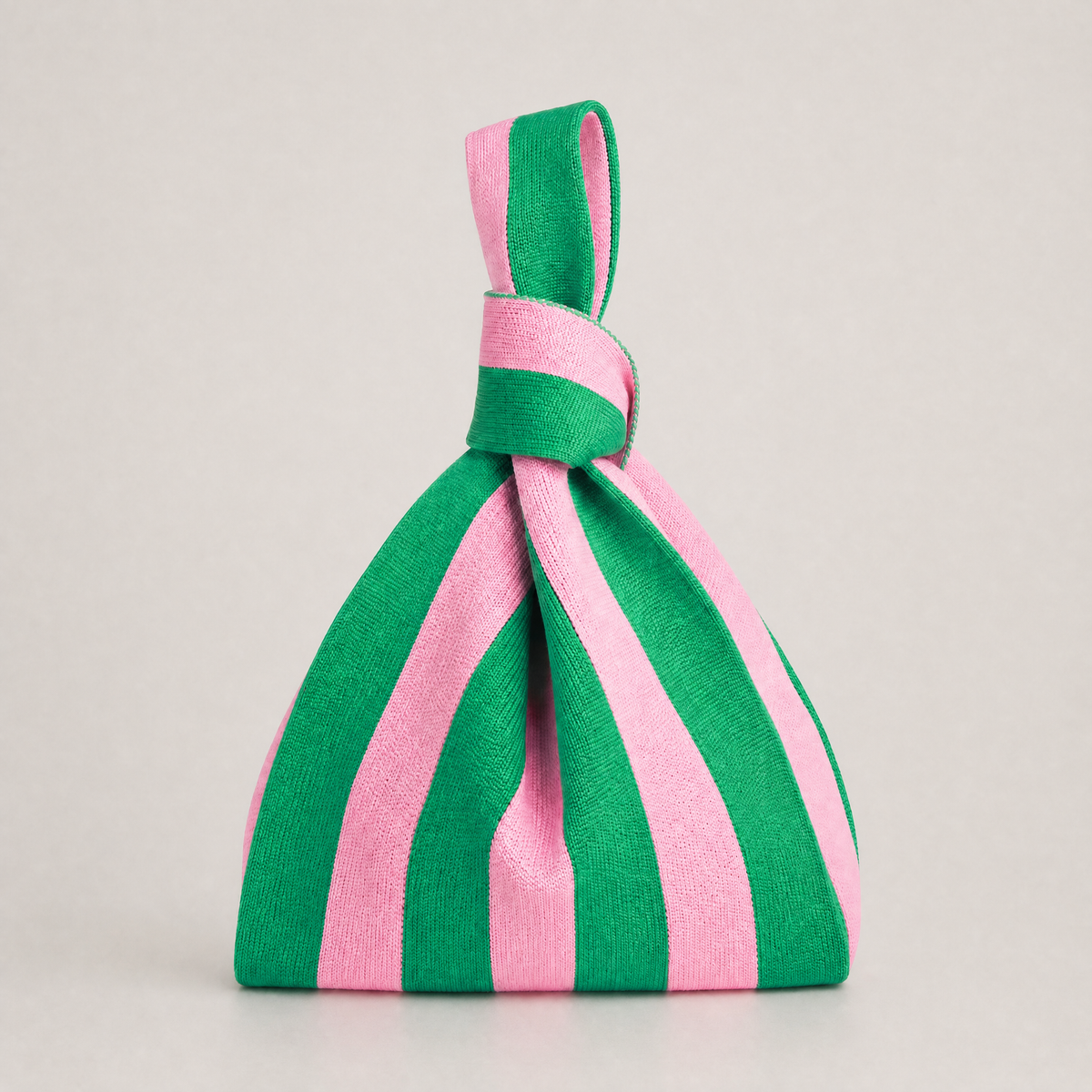 Striped drawstring handbag with green and pink fabric straps and tied top