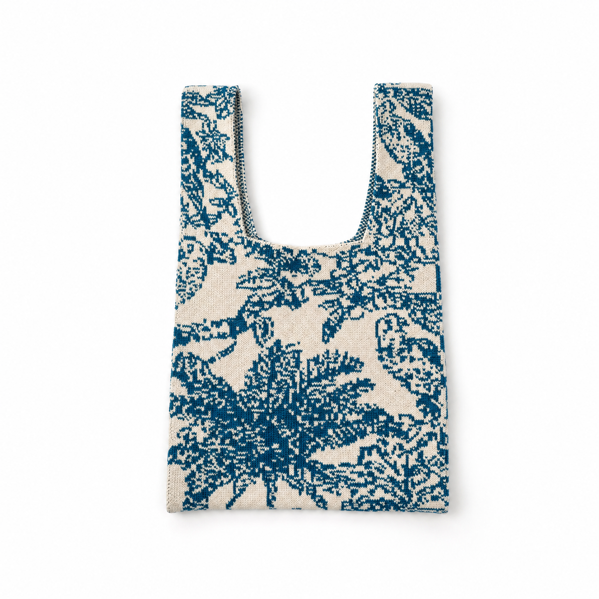 Blue and white woven U-shape handbag with open top and cutout shoulder strap