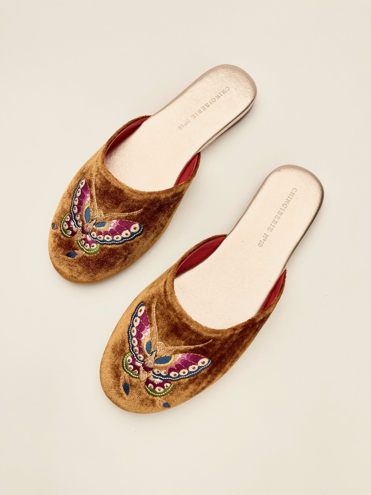 Antique gold velvet mule slippers with butterfly embroidery on the front