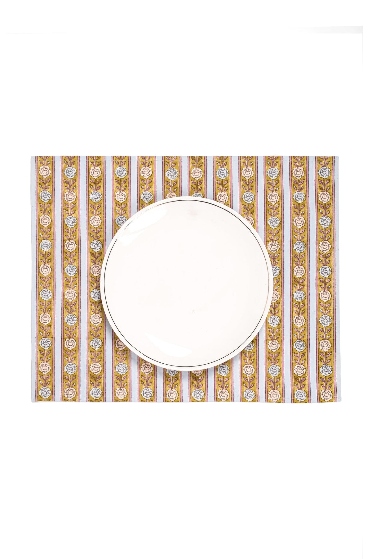 Blue floral striped placemat with round white plate centered