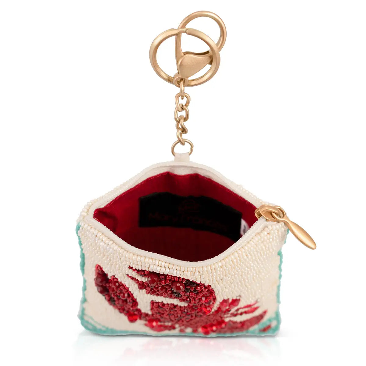Beaded coin purse with red crab design; open top shows red lining and gold-tone key ring