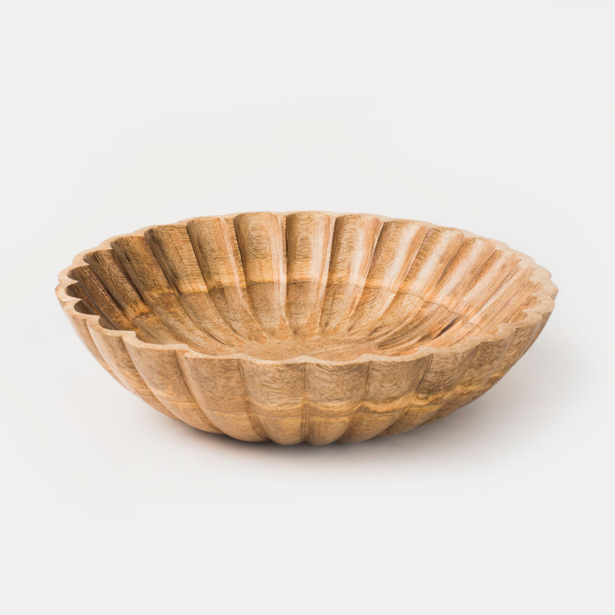 Natural scalloped wooden serving bowl with carved fluted pattern along the sides