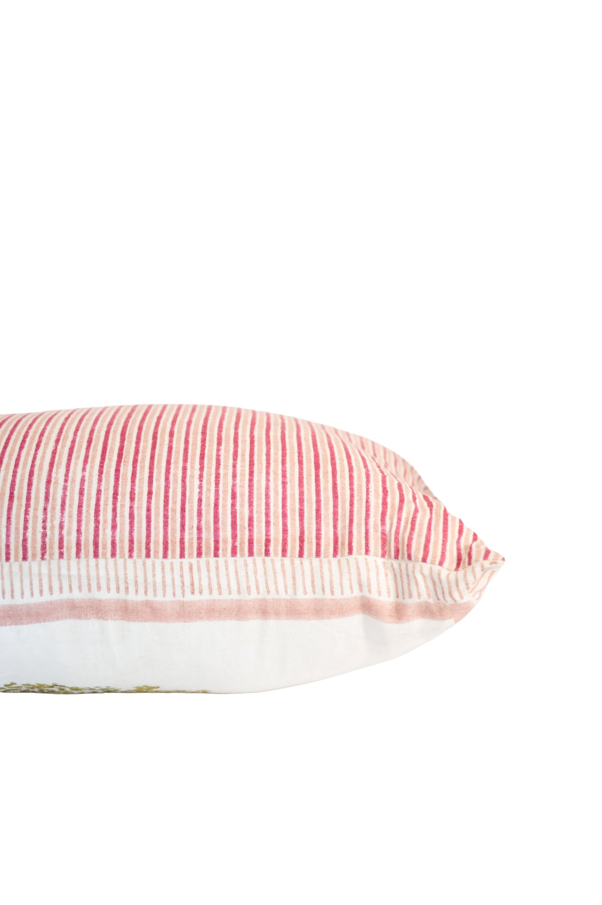Block print cushion showing striped fabric side with pink-and-white piping trim