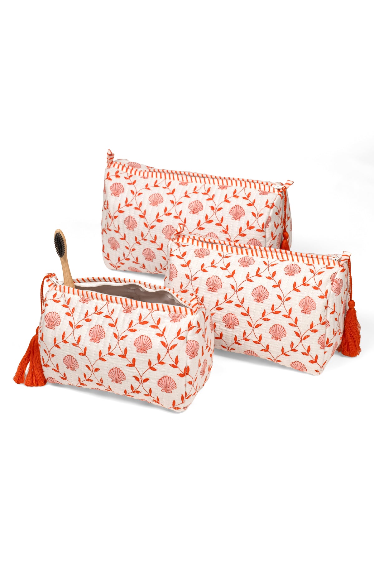 Set of two blockprint makeup bags, white with orange floral circles, tassel zipper pull