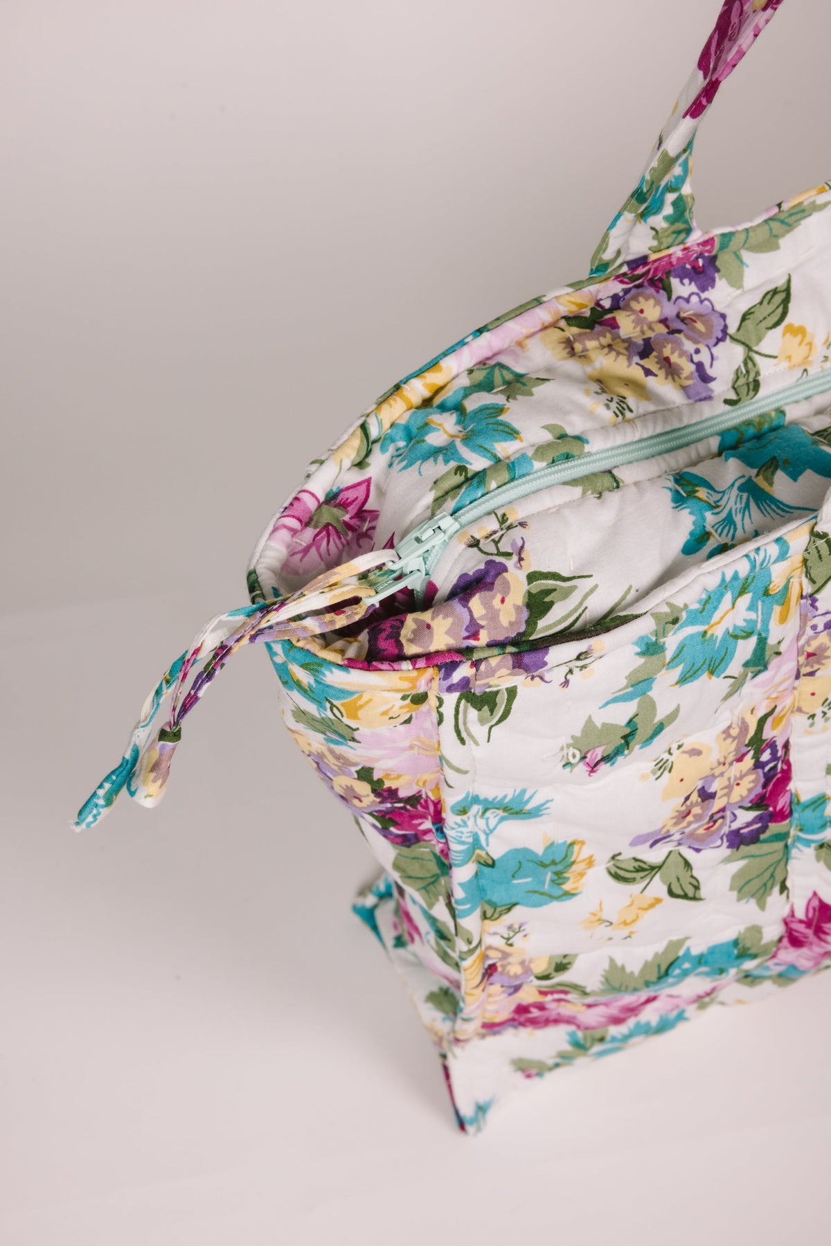 Floral zip tote bag with top zipper and tie drawstring, pastel flower print