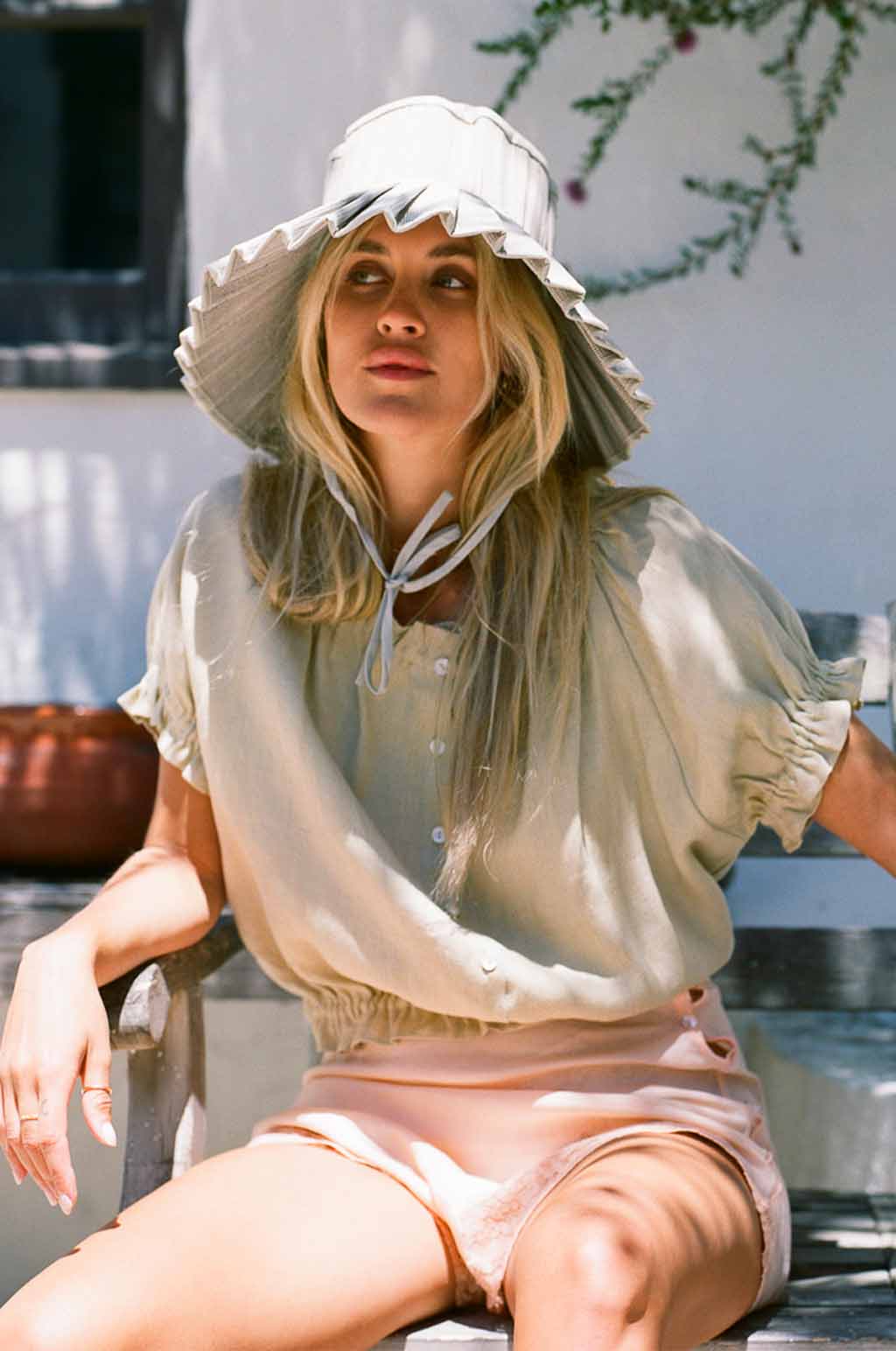 Sage linen ruffle blouse with ruffled collar and button placket