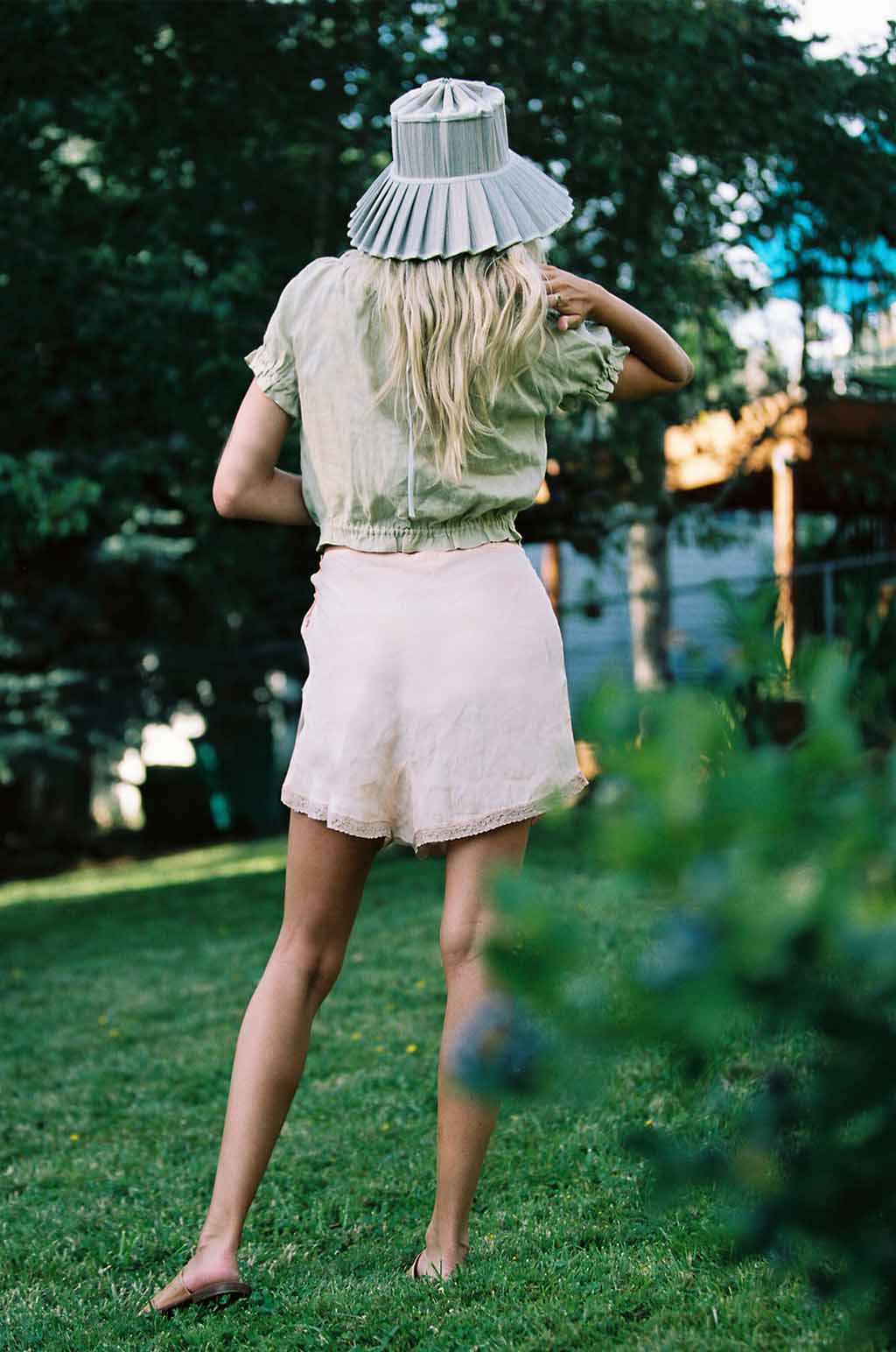Sage linen ruffle blouse with short puff sleeves and back yoke ruffles