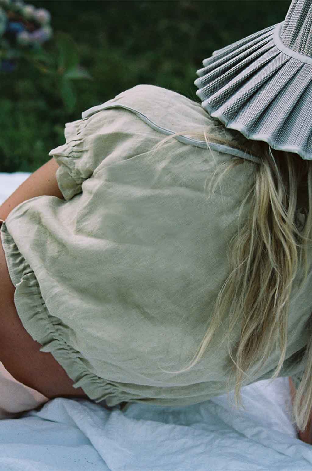 Sage linen ruffle blouse back detail with gathered shoulders and ruffled collar