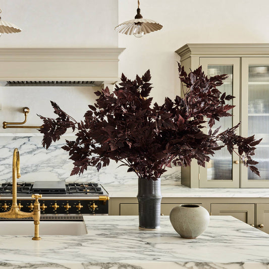 Artificial faux leaf spray with dark plum leaves, wide canopy on a single stem