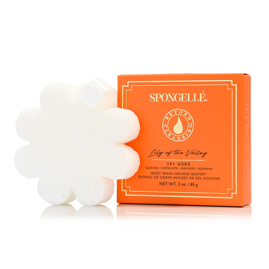 White flower-shaped body buffer with orange SPONGELLE Lily of the Valley box