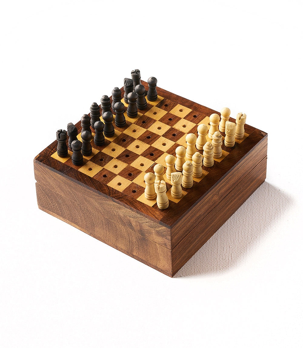 Wooden chessboard case with checkered squares and light/dark peg chess pieces
