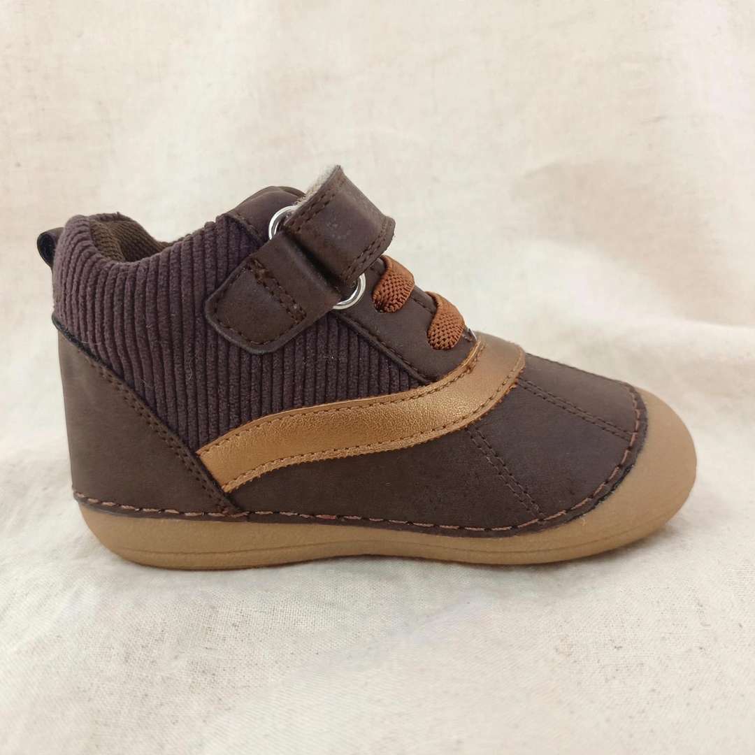 Kids barefoot boot angled view, dark brown upper, tan trim, hook-and-loop strap, loop