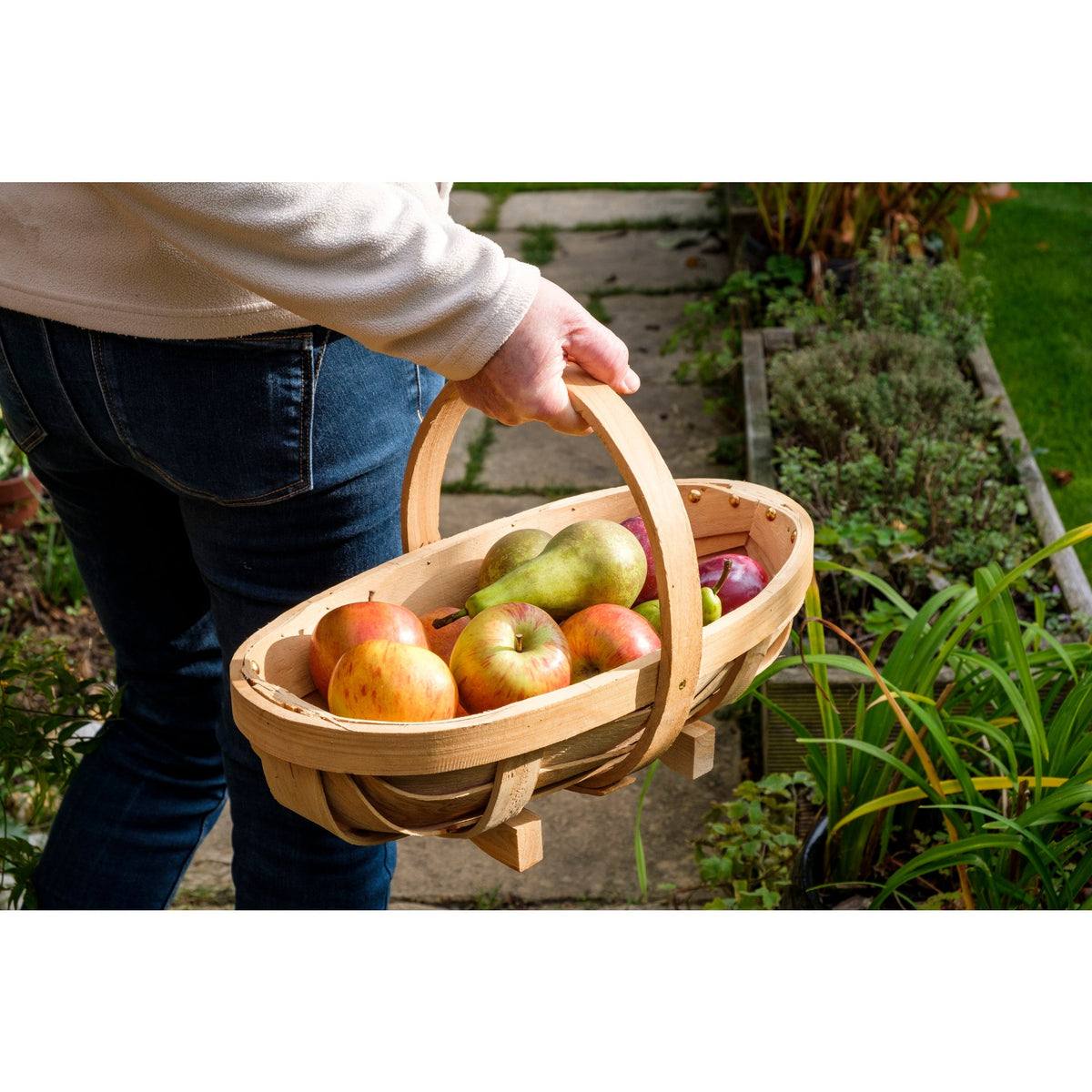 Medium natural wooden trug with arched handle, filled with apples and pears