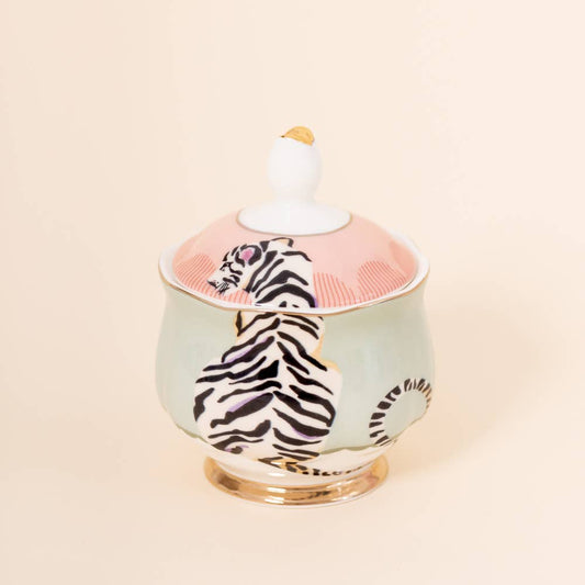 Tiger-print sugar bowl with white knob lid on a mint-green ceramic base