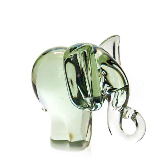 Green-tinted glass elephant figurine with raised trunk and reflective surface